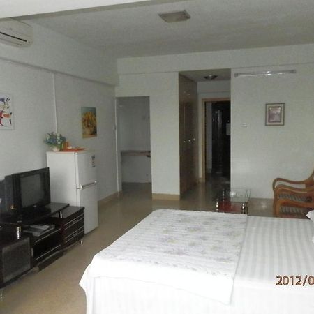 Xingfu Hotel Наньнін Номер фото