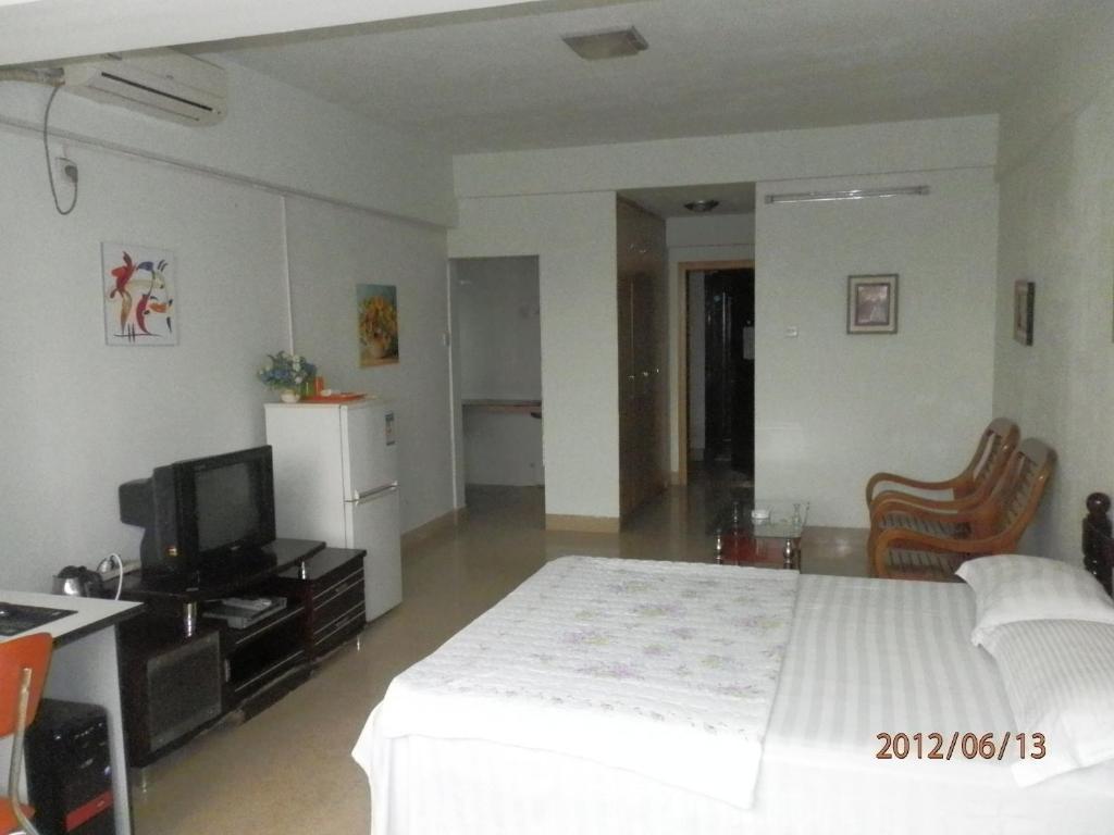 Xingfu Hotel Наньнін Номер фото