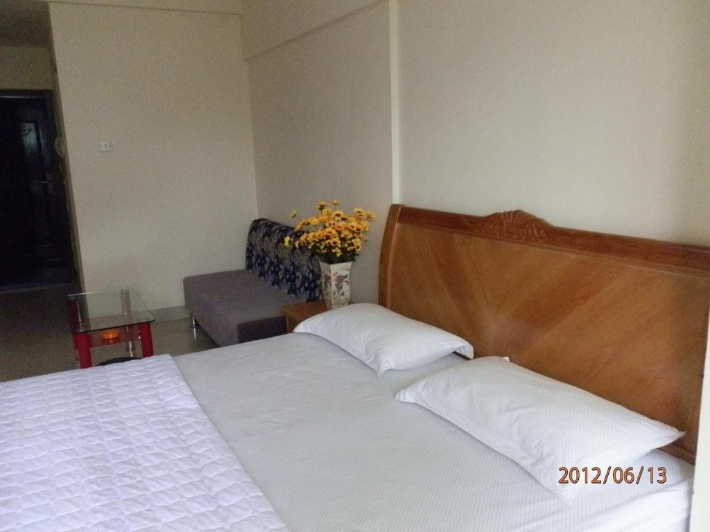 Xingfu Hotel Наньнін Номер фото